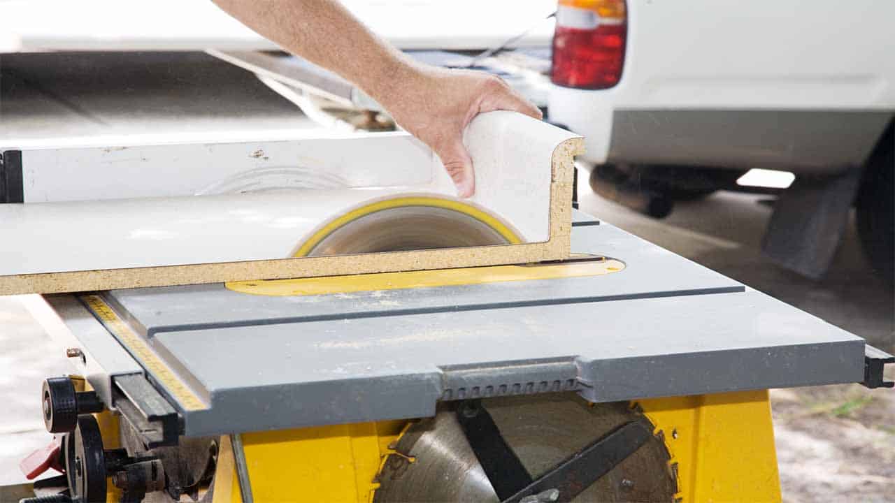 A table saw is a power saw that is used mostly to cut wood. It comes with a table and a blade at the center of the table. You have to push the materials through that blade to get a cut. Table saws can be very bulky, so if you decide to buy one then make sure to have a large space in your garage.