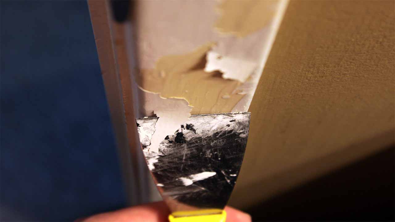 After you apply the paint stripper, you should use a knife or a putty knife to scrape the paint off the surface. Although, the paint stripper takes most of the paint off, you still have to scrape the paint that is left with a putty knife.